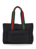 Gucci Men Black Tote Bag With Web Handles And Logo Lettering On The Front In Tech Fabric Man