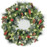 National Tree Company 24 in Pre-Lit Crestwood Spruce Artificial Christmas Wreath, Christmas Decoration with Glitter, Pinecones, Red Berries, 50 Clear LED Lights, 160 Tips, Timer, Green