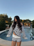 Women's spring suit 2026 European and American spring and summer women's fashionable lady solid color sweater short skirt suit