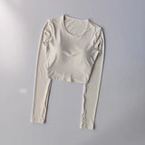 Women's long sleeved yoga suit sports top, high-end tight fitting hollow back fixed chest cushion