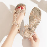A pair of women's square-toe flat sandals, stylish silver sandals adorned with floral decorations 2026