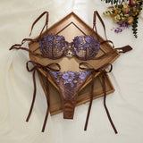 A limited edition brown and purple lace lingerie set with rose embroidery, see-through netting bra, and tie-up thong ZA825200