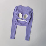 Women's long sleeved yoga suit sports top, high-end tight fitting hollow back fixed chest cushion