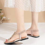A pair of women's square-toe flat sandals, stylish silver sandals adorned with floral decorations 2026