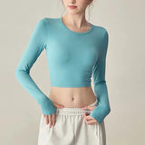 Women's long sleeved yoga suit sports top, high-end tight fitting hollow back fixed chest cushion