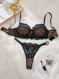 A Set of Black Sexy Lingerie, Featuring Leopard Print and Floral Patterns. The Lace Design Combines Charm with Sexiness ZA825182