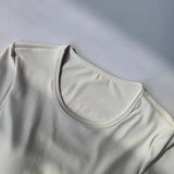 Women's long sleeved yoga suit sports top, high-end tight fitting hollow back fixed chest cushion
