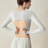 Women's long sleeved yoga suit sports top, high-end tight fitting hollow back fixed chest cushion