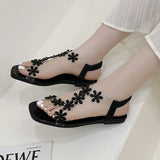 A pair of women's square-toe flat sandals, stylish silver sandals adorned with floral decorations 2026