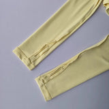Women's long sleeved yoga suit sports top, high-end tight fitting hollow back fixed chest cushion