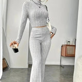 Stand Collar Navel T-shirt and Trumpet pants