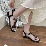 A pair of women's square-toe flat sandals, stylish silver sandals adorned with floral decorations 2026