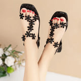 A pair of women's square-toe flat sandals, stylish silver sandals adorned with floral decorations 2026