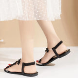 A pair of women's square-toe flat sandals, stylish silver sandals adorned with floral decorations 2026