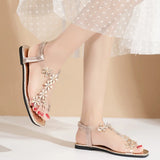 A pair of women's square-toe flat sandals, stylish silver sandals adorned with floral decorations 2026
