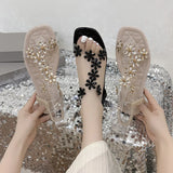 A pair of women's square-toe flat sandals, stylish silver sandals adorned with floral decorations 2026