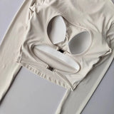Women's long sleeved yoga suit sports top, high-end tight fitting hollow back fixed chest cushion
