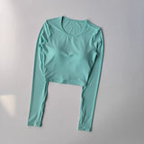 Women's long sleeved yoga suit sports top, high-end tight fitting hollow back fixed chest cushion