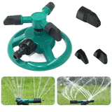 Blue Rotating Garden Sprinklers Watering Grass