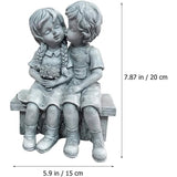 Boy Kissing Girl Statue Sitting on Bench Figurine