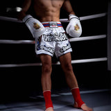 Boys Muay Thai Boxing Training With A Punching Bag And Gloves