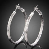 Diamond Cut Hoop Earrings In White Gold