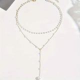 Elegant Vintage Style Double-Layer Pendant Necklace with Imitation Pearl Accents and Tassel Drop