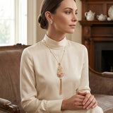 Carolee Pear Shaped Caged Pendant Tassel Necklace